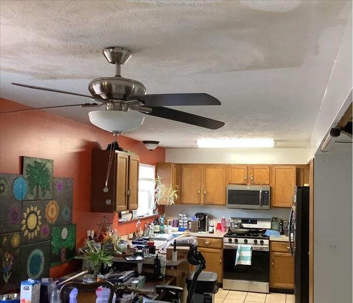 A kitchen ceiling has water damage.