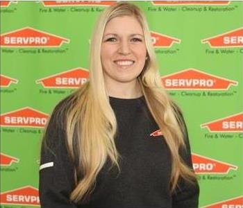 Jenna Ficken, Human Resources Manager, blonde employee in front of SERVPRO logo