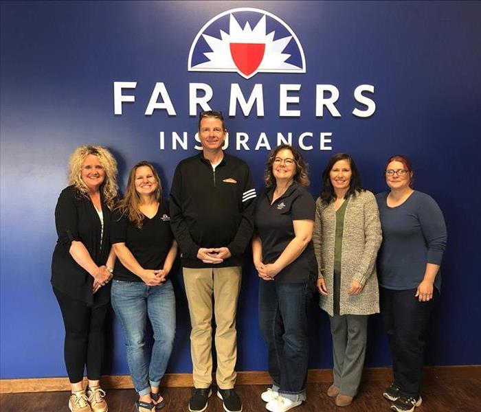 SERVPRO team member Rodd Meyer stands with agents from Tanya Burleson Farmers Agency.
