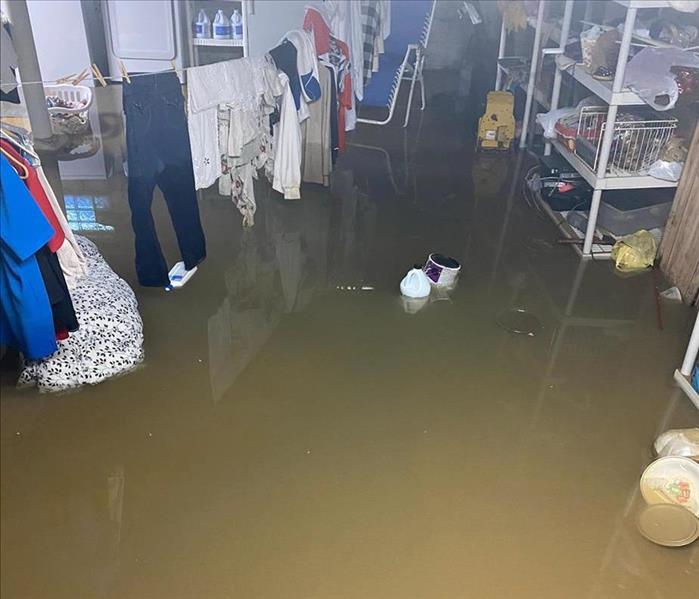 image of residential basement extremely flooded without the floor visible at all
