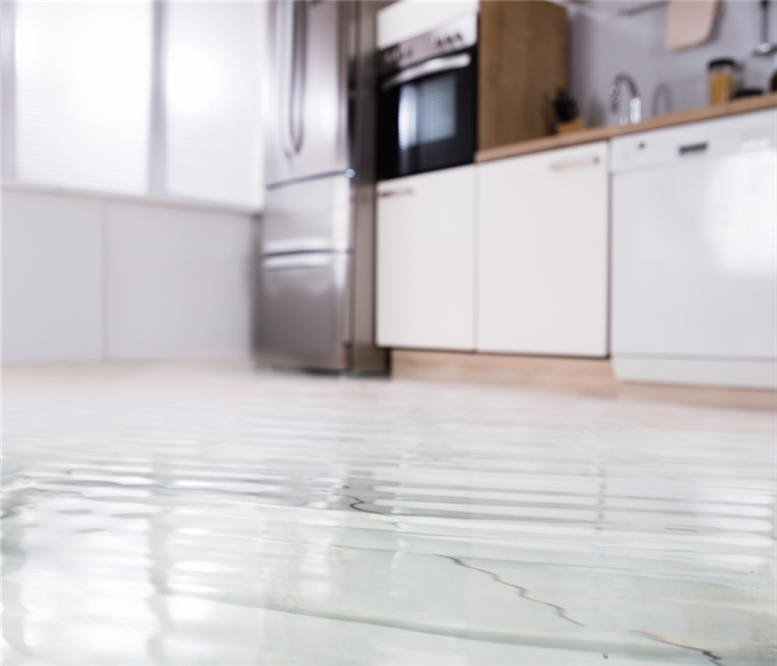 Water flooding a house kitchen.