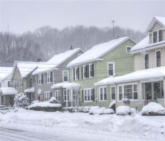 row of houses covered in snow